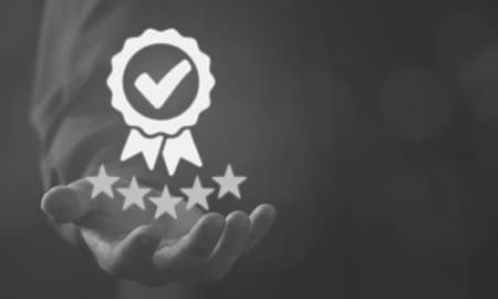 a hand holds out a rating of 5 stars and verification sticker