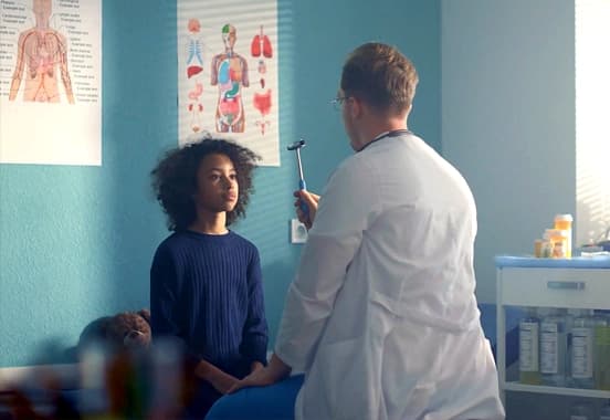 child getting examined at the hospital
